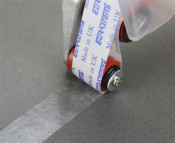 Double sided tape being applied